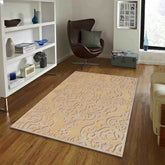 Luxury traditional rug in gold beige with raised damask design
